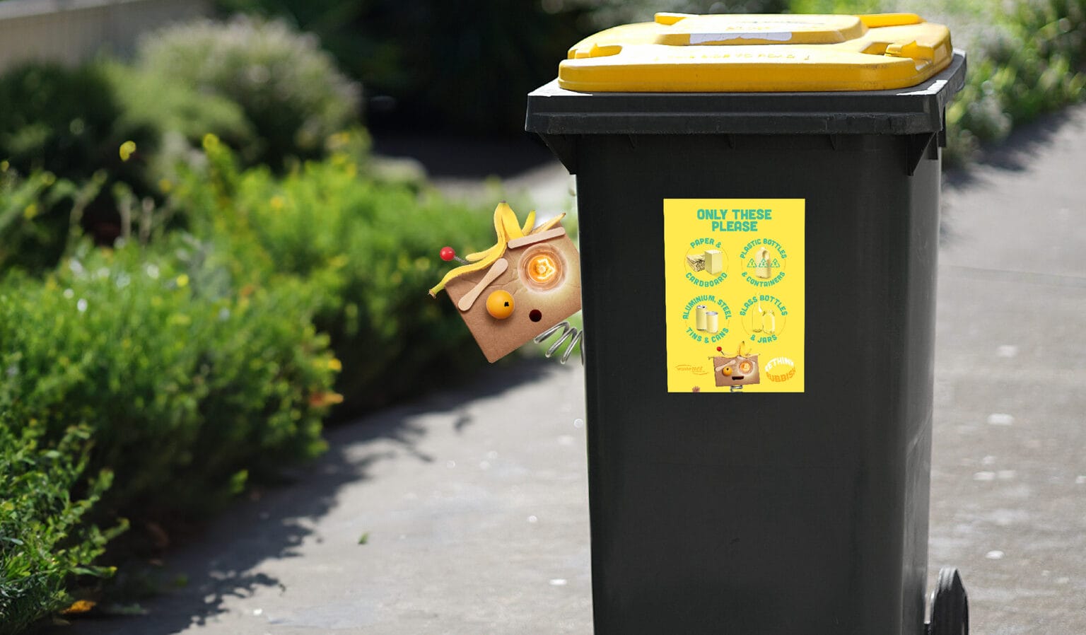 Bitz McGee behind Yellow Bin